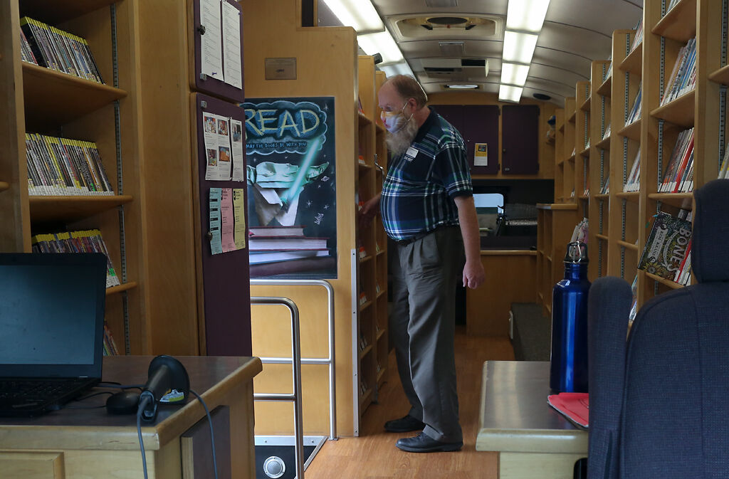 Bus driver Tracy Prince from Rocheport stands in the doorway
